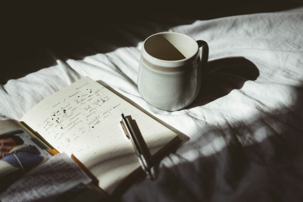 Open journal and pen in warm natural light